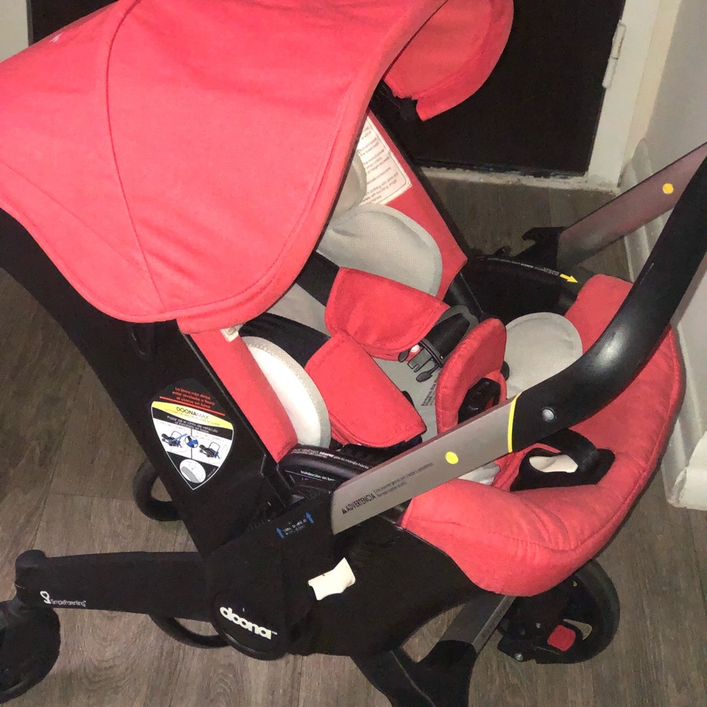 Doona car seat stroller /coral -peach color